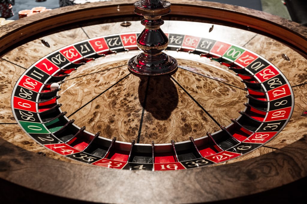 A photo of an American roulette wheel in a casino.