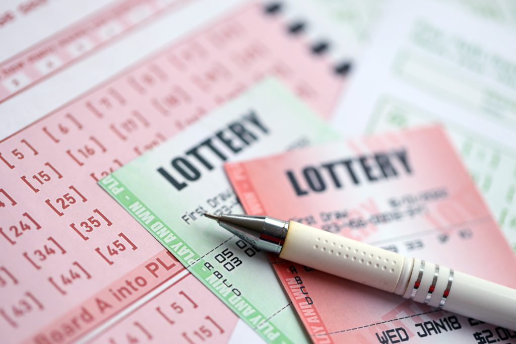 A photo of a red and green lottery ticket.