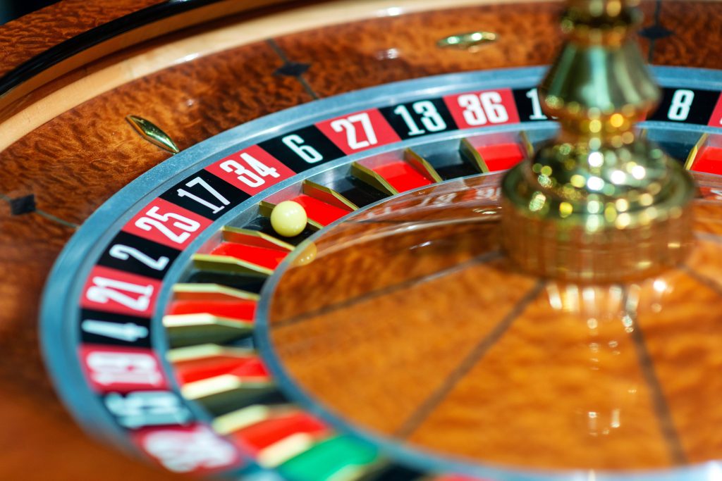 A close up photo of a roulette wheel, with the ball in the number 17 pocket.