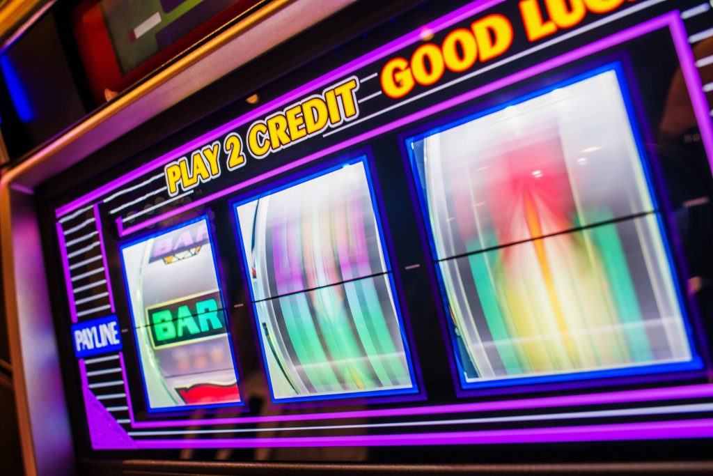 A photo of a slot machine with two spinning reels.