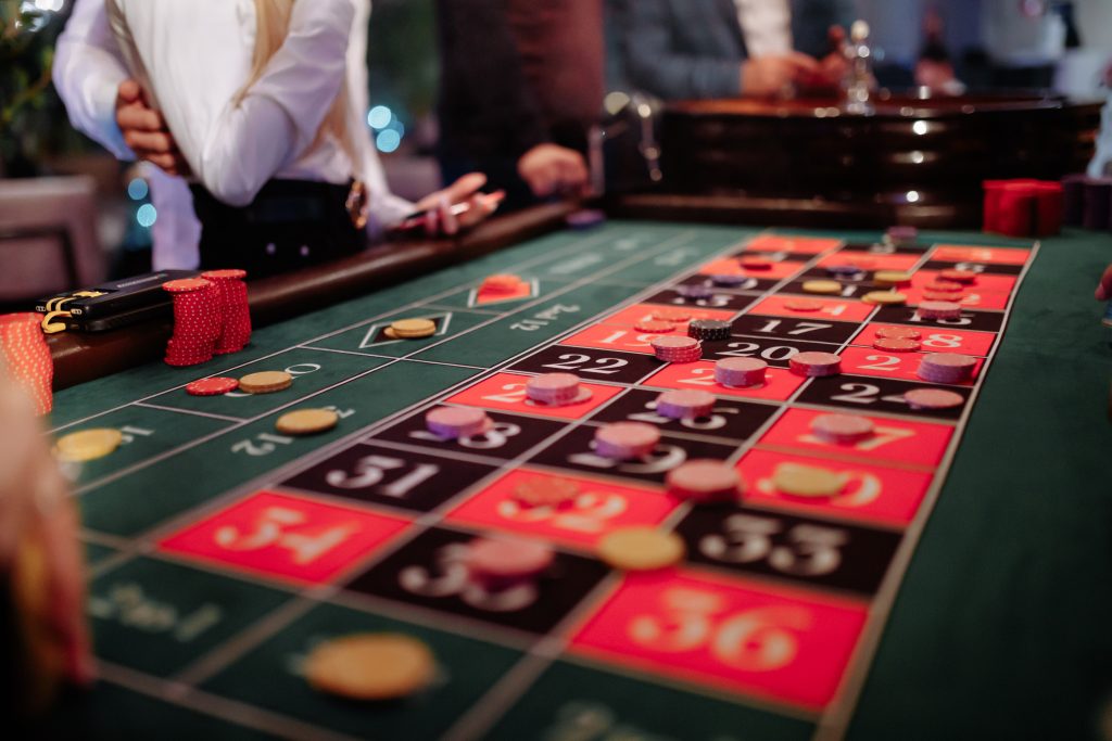 A photo of a roulette table with different bets placed on it.