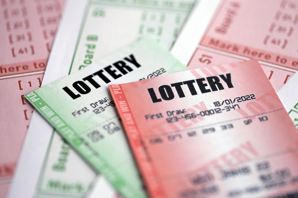 A close up photo of two lottery tickets.