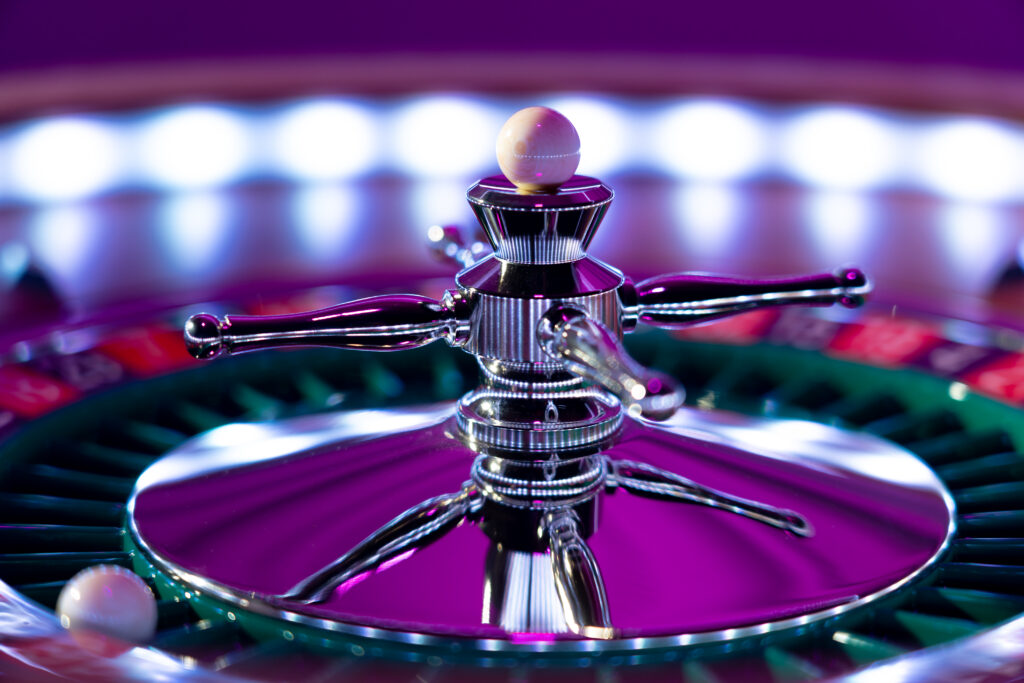 Close up of a roulette wheel at a casino.