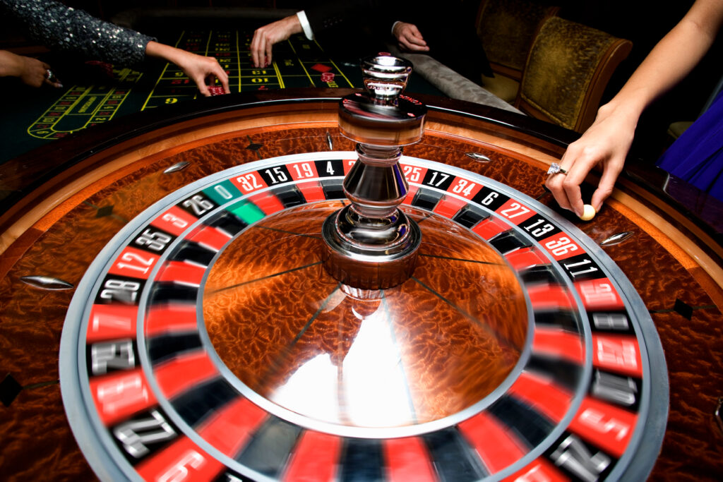 Roulette wheel at a casino. The croupier is about the release the ball.