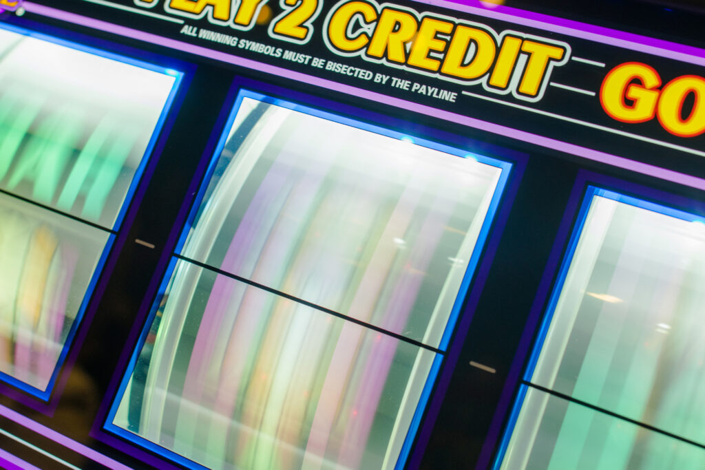 Close up of a slot machine's spinning reels.
